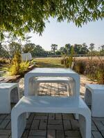 The terrazzo table and chair are set on the terrace. photo