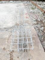 The steel truss frame for use with the groundwork of the house. photo