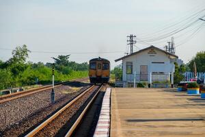 The diesel multiple unit is leaving from the local station. photo