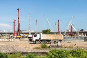 The large truck carrying dirt from a construction site. photo