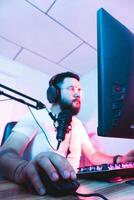 selective focus to the hands and fingers of a professional video game player holding a mouse. photo