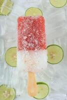 Red and White Fresh Fruit Popsicle Ice Cold Summer Dessert photo