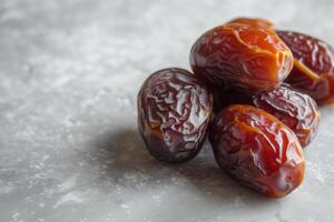 AI generated Dates on grey marble, with copy space, for the Ramadan concept photo