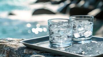 AI generated Two glasses of ice water on a tray with ice rocks, a cool arrangement, Ai Generated. photo