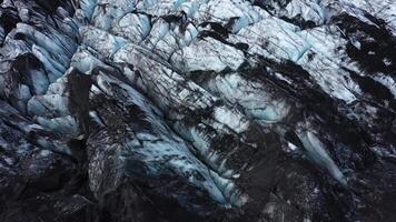 Melting glacier. Textured rocky slope in Iceland. Drone video. video