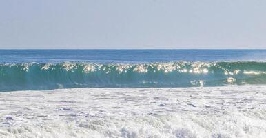 Extremely huge big surfer waves at beach Puerto Escondido Mexico. photo