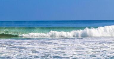 Extremely huge big surfer waves at beach Puerto Escondido Mexico. photo