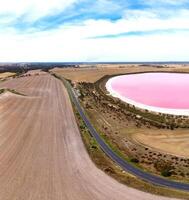 Aerial view of Dimboola pink lake Nature Reserve of western Victoria, Australia,  the Pink Lake gets its vibrant colour from a salt tolerant alga living in the salt crust. photo