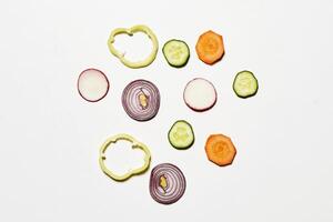 a white background with sliced vegetables photo