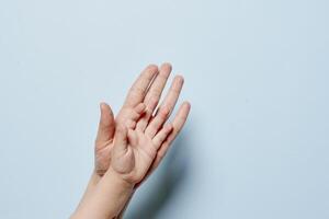 Adult and baby hand together photo