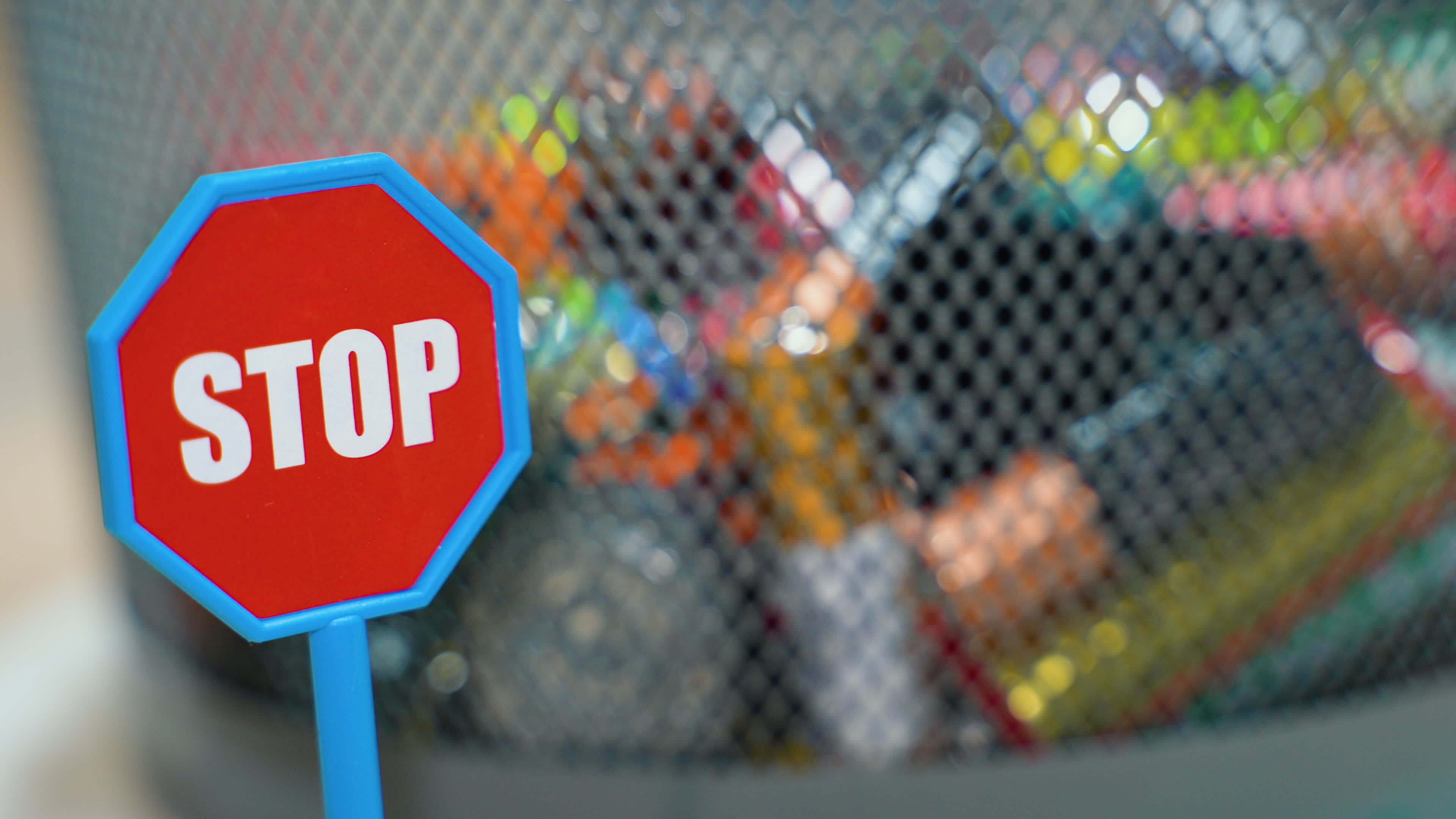Different battery rotate in garbage bin. Stop pollution by batteries