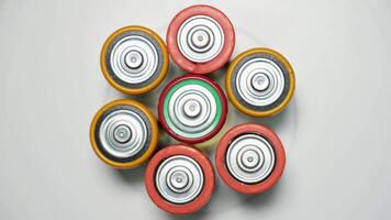 Old used batteries type D rotate in a circle video