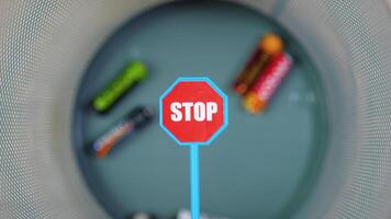 A person throws used batteries into office garbage bin. Stop pollution by batteries video