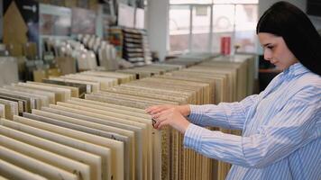 Woman browsing tile samples in home improvement store video