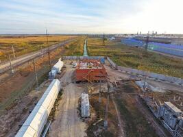 Russia, Krasnodar 2021. Construction of a brick building. Installation of the roof. Construction works. photo