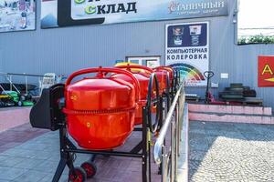 Russia, Krasnodar 2021. Domestic Concrete Mixer stand in a row on the street at the entrance to the store. Sale of concrete mixers. Concrete Mixer for individual home use photo