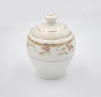 Elegant white ceramic tea coffee canisters, tea pot, coffee pot photo