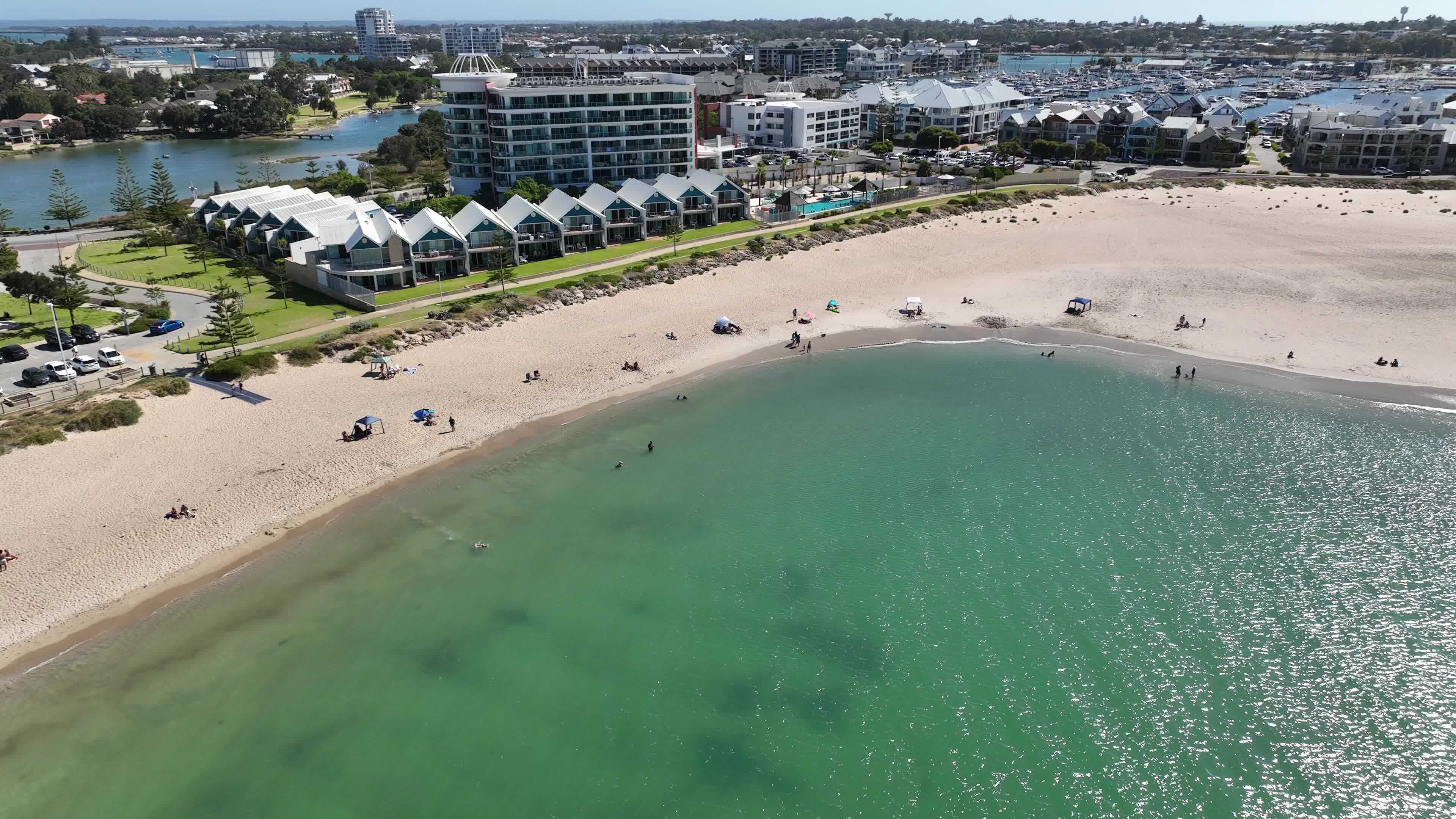 white sand beach hotel buildings mandurah australia 4k sunbathers