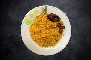 Hilsa Khichuri with salad. Traditional Baisakhi Rice Hilsa fries with salad, lemon, green chili, and onion. Bengali traditional food Hilsa fry with khichuri. photo