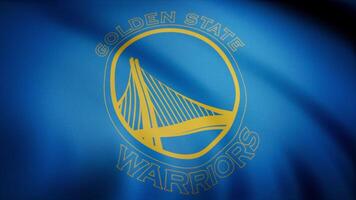 Basketball Golden State Warriors flag is waving on transparent background. Close-up of waving flag with Golden State Warriors basketball club logo, seamless loop. Editorial animation video