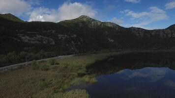 Nice view on the ocean with mountains aerial. Footage. Beautiful landscape aerial. View from helicopter at mount and sea. Beautiful sky with clouds video