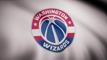 Basketball Washington Wizards flag is waving on transparent background. Close-up of waving flag with Washington Wizards basketball club logo, seamless loop. Editorial animation video