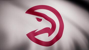 Basketball Atlanta Hawks flag is waving on transparent background. Close-up of waving flag with Atlanta Hawks basketball club logo, seamless loop. Editorial animation video