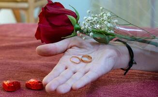 valentines day hand giving engagement rings photo