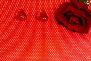 valentines day rose and chocolates on a polka dot background photo