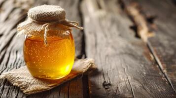 AI generated A jar of honey sits atop a weathered wooden table, evoking a sense of rustic elegance photo