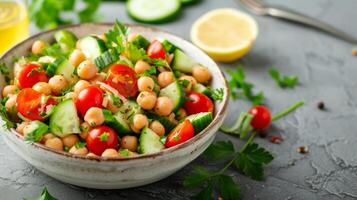 AI generated A light and healthy chickpea salad with cherry tomatoes, cucumbers, and a lemon tahini dressing photo