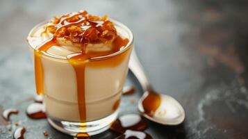 AI generated A luscious butterscotch pudding served in a glass, drizzled with caramel sauce photo