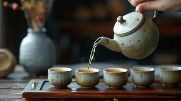 ai generado un té Maestro torrencial té desde un alto cerámico tetera dentro pequeño tazas durante un chino té ceremonia foto