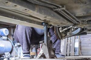 Forged car for a hundred. Car repair. Car view from below photo