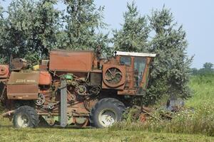 Old rusty combine harvester. photo