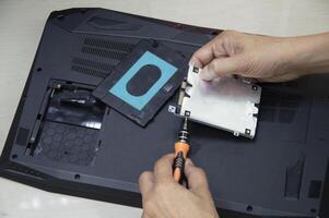 Top view, technician wearing Hard disk, computer repair photo