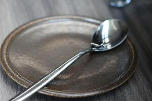 Empty Plate Table Setting with ladle on plate ready to use photo