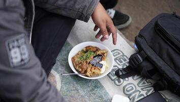 a bowl of meatballs complete with tofu and noodles, street vendors, typical street food from Bandung, West Java photo