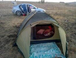 Set up a tent on the grass green photo