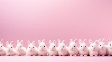 ai generado blanco Pascua de Resurrección conejitos en un fila en rosado foto