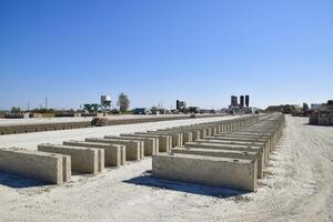 Cinder blocks lie on the ground and dried. on cinder block production plant. photo