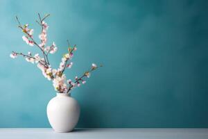 AI generated Blossom branch in ceramic vase near studio wall background, space for text photo