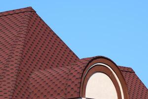 Decorative metal tile on a roof photo