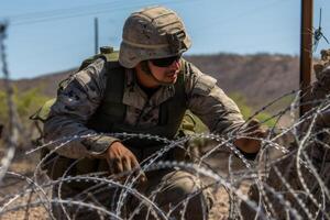 AI generated A Texas National Guard soldstrung barbed wire along the border with Mexico photo