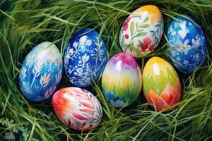 ai generado Pascua de Resurrección huevos acostado en el césped. cada huevo es decorado con diferente patrones y colores foto