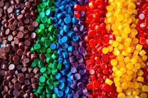 AI generated Dyed synthetic polymer resins granulates. Recycled plastic granules with mixed colors photo