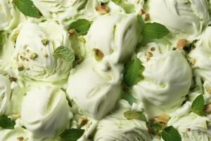 AI generated Delicious refreshing creamy Italian pistachio nuts ice-cream for a summer dessert or takeaway, close up full frame background texture photo