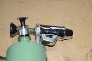 Blowtorch, general view. Blowtorch a with a green tank photo