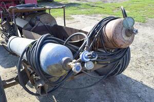 Gas welding equipment. A cylinder with propane and a cylinder with oxygen photo