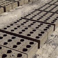 Cinder blocks lie on the ground and dried. on cinder block production plant. photo